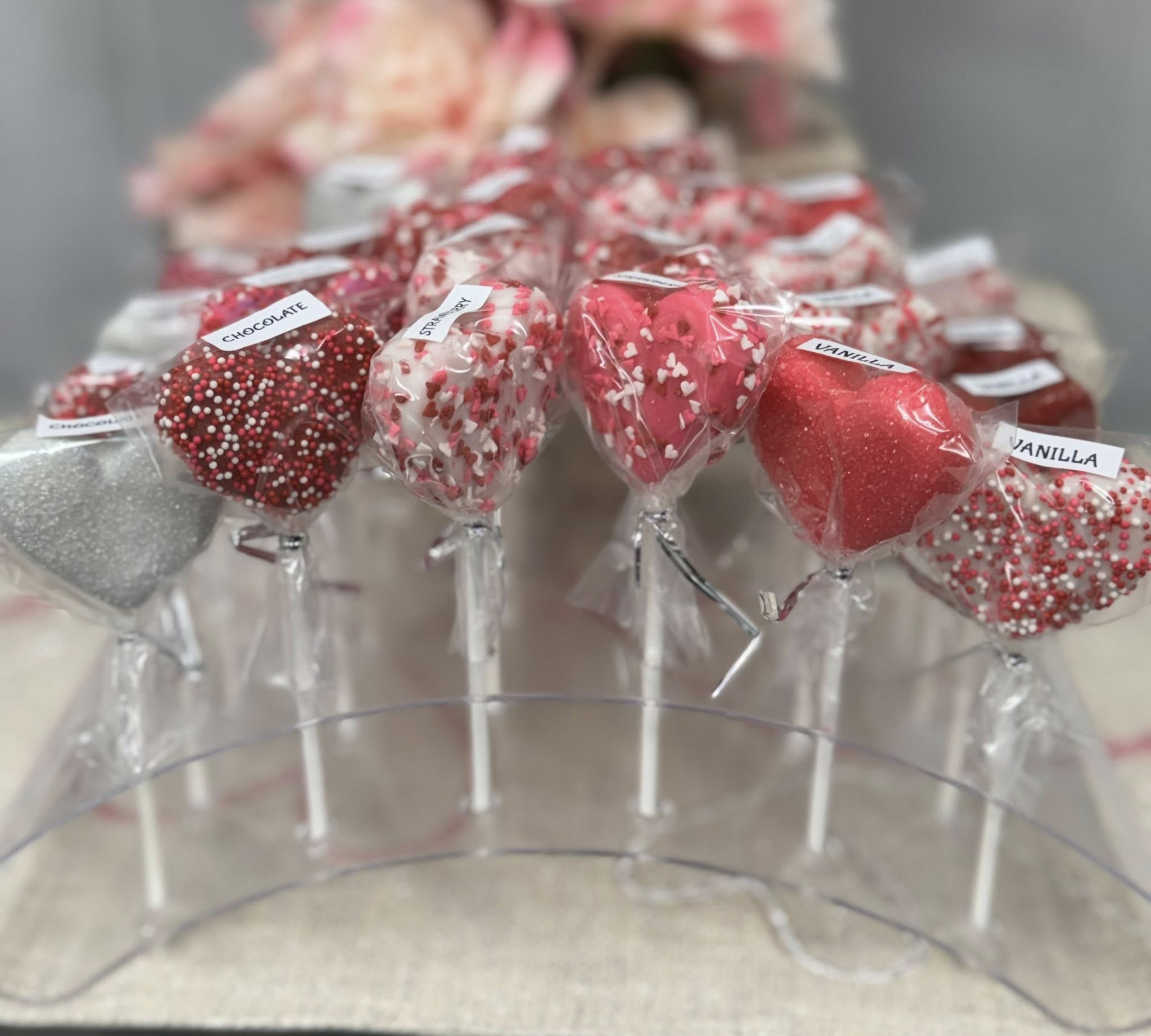 Heart-shaped Valentine cake pops in chocolate, strawberry, and vanilla